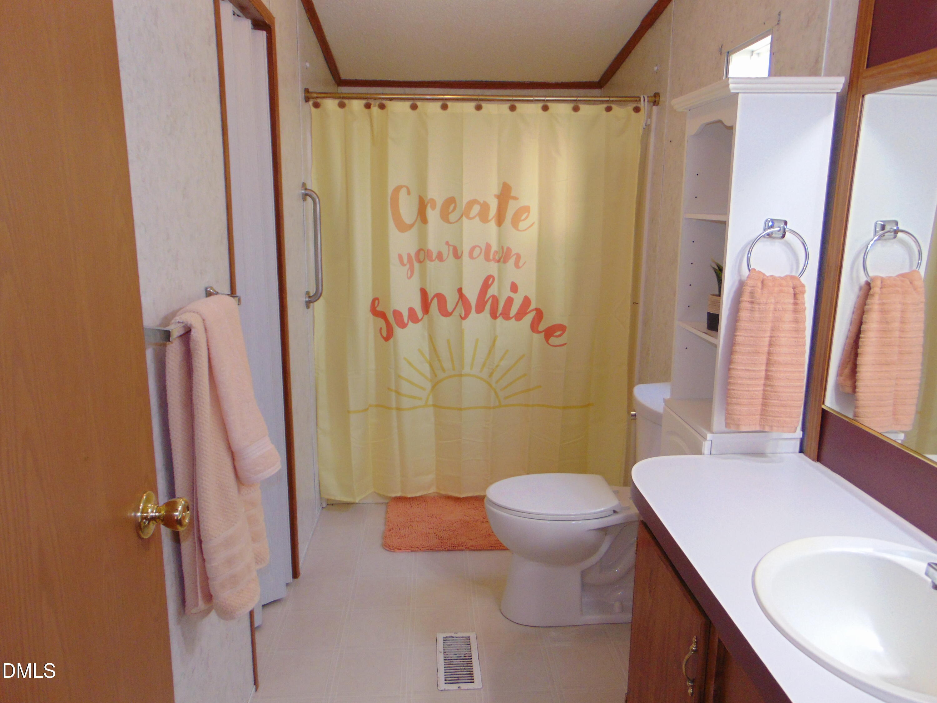 130 Lake View Road Prospect Hill, NC 27314 - Photo 59 of 73 a bathroom with a sink toilet and shower