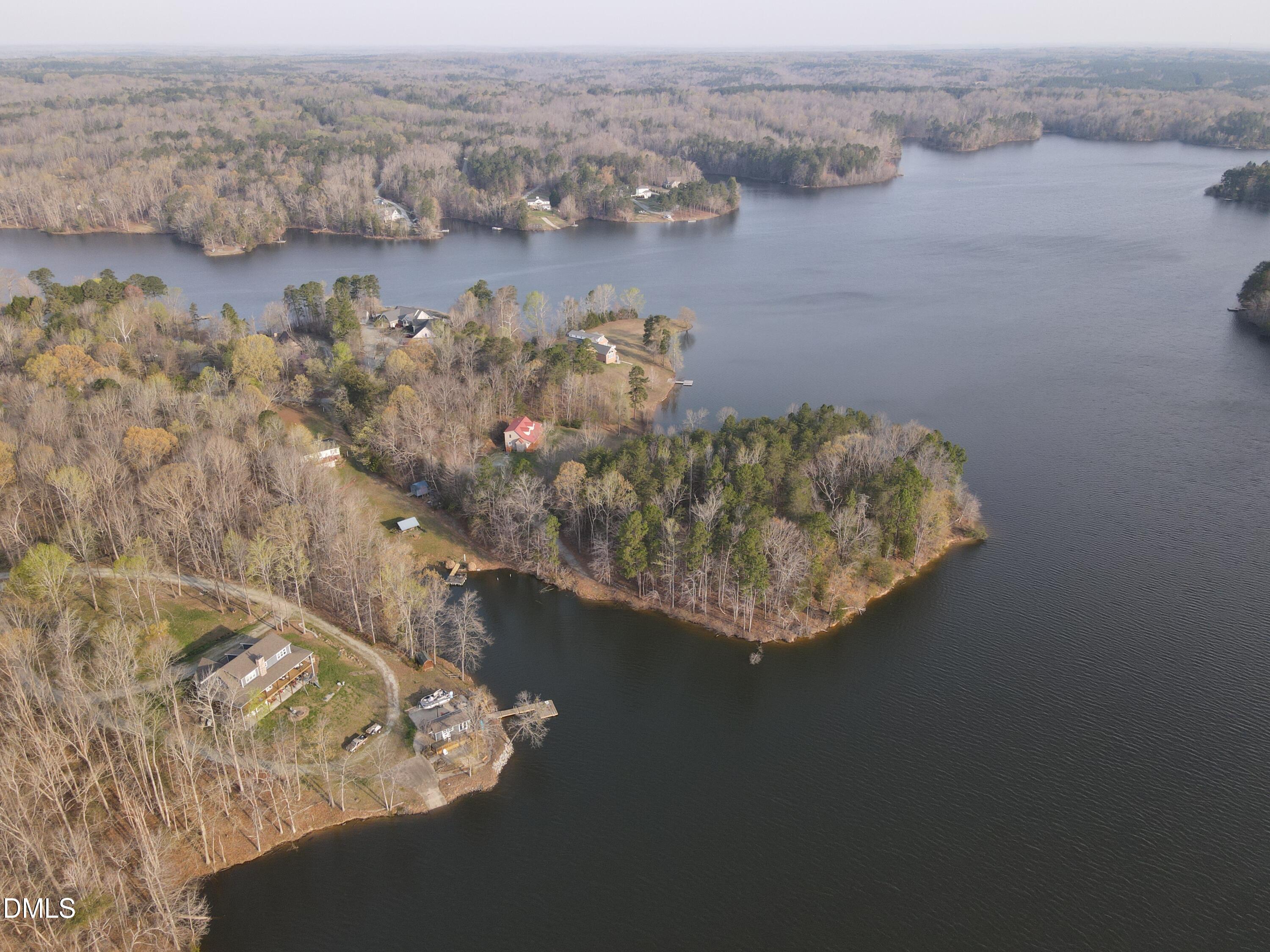 130 Lake View Road Prospect Hill, NC 27314 - Photo 6 of 73 a view of a lake with a mountain in the background