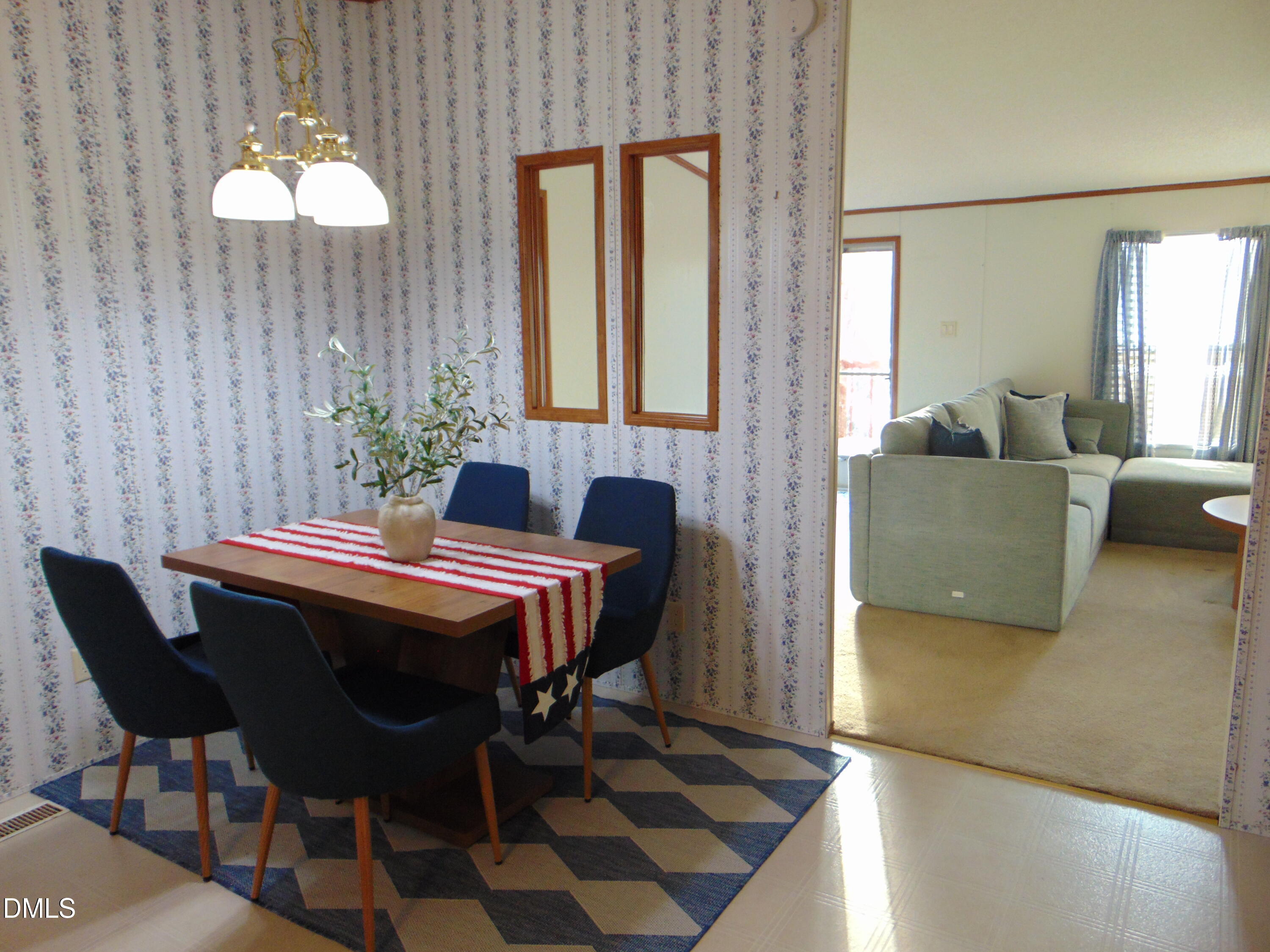 130 Lake View Road Prospect Hill, NC 27314 - Photo 63 of 73 a dining room with furniture and wooden floor