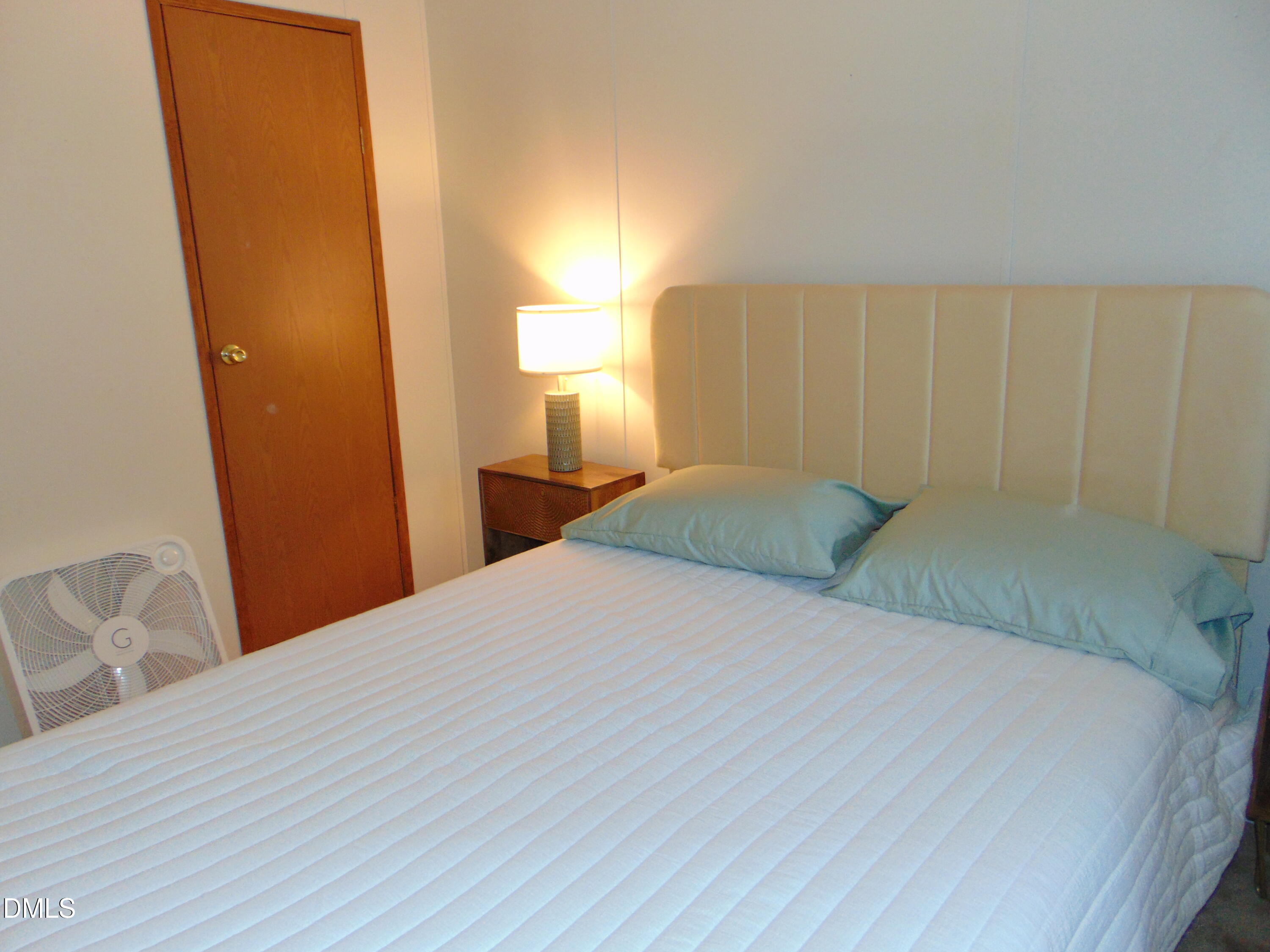 130 Lake View Road Prospect Hill, NC 27314 - Photo 64 of 73 a bedroom with a bed and a window