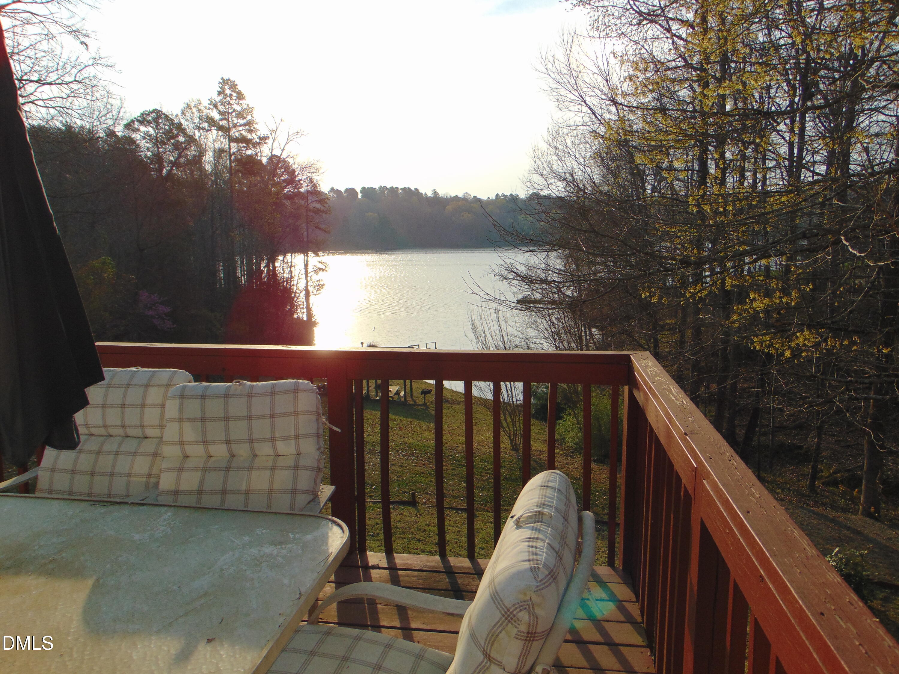 130 Lake View Road Prospect Hill, NC 27314 - Photo 70 of 73 a balcony with view of trees in the background