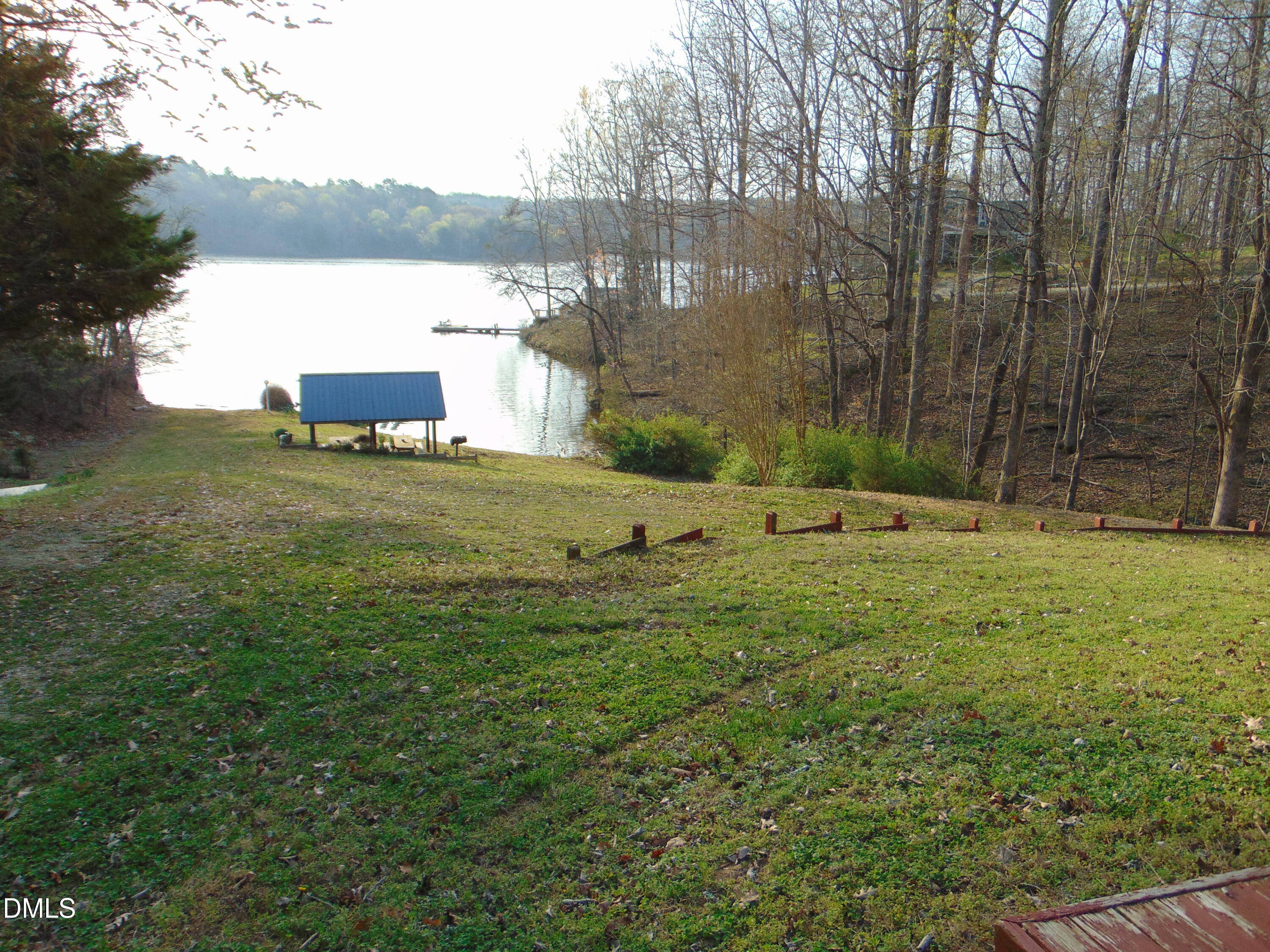 130 Lake View Road Prospect Hill, NC 27314 - Photo 71 of 73 a backyard of a house with lots of green space and fountain