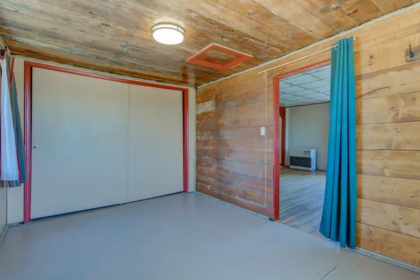 a room with a table and chairs in it