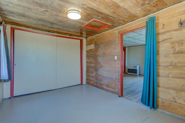 a room with a table and chairs in it