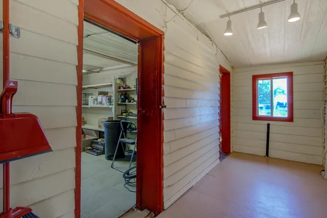 a room with a wooden floor and shoes store