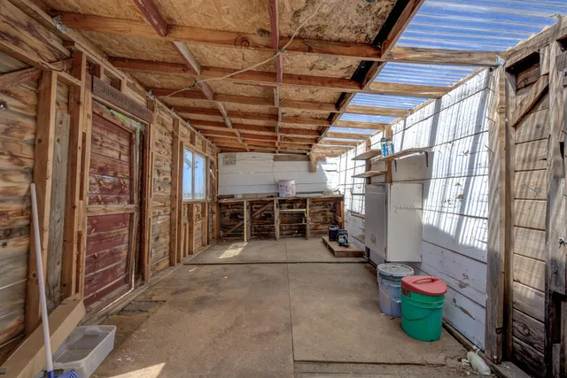 a view of water heater room with wooden ceiling