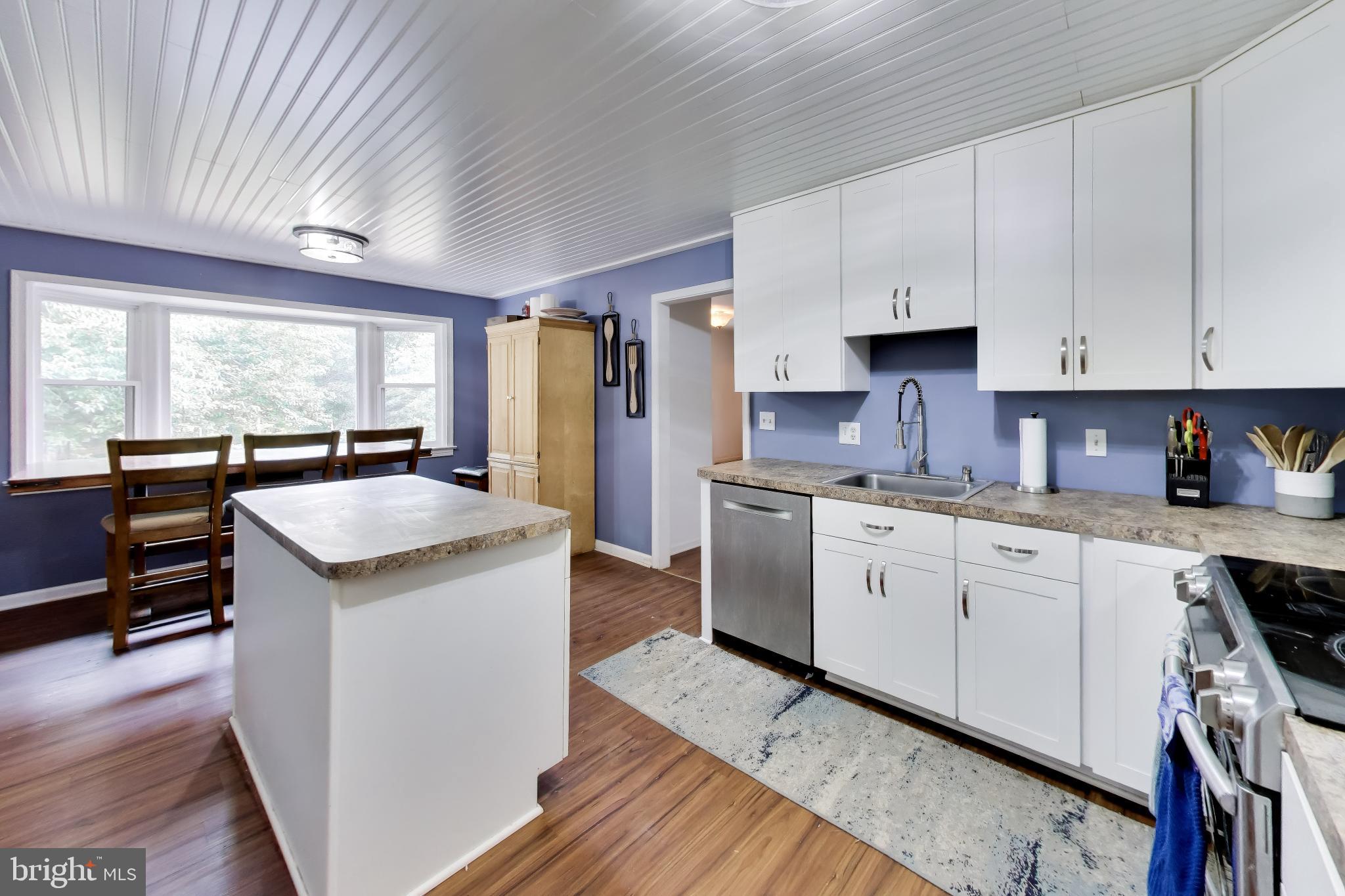 3240 Juniper Lane Huntingtown, MD 20639 - Photo 6 of 48 a kitchen with a sink stove and cabinets