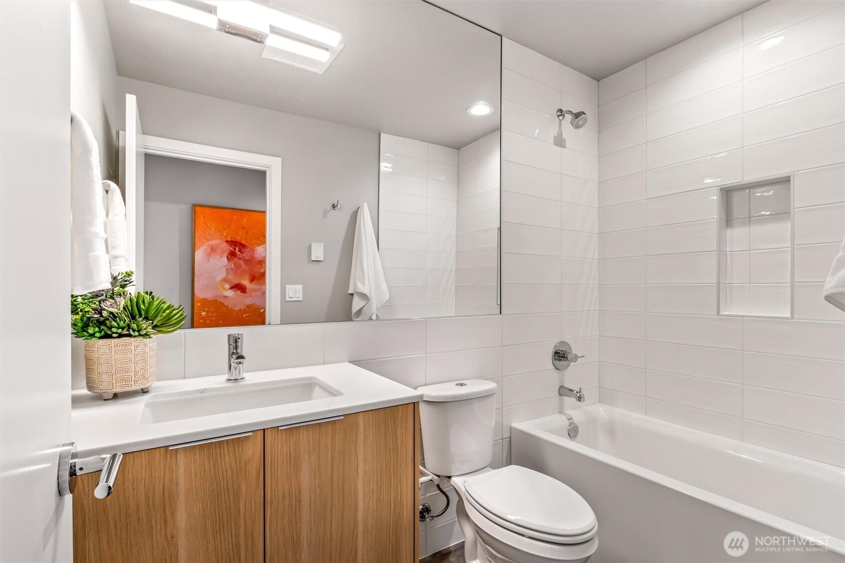 4460 Midvale Avenue North Seattle, WA 98103 - Photo 31 of 40 a bathroom with a sink a toilet and shower