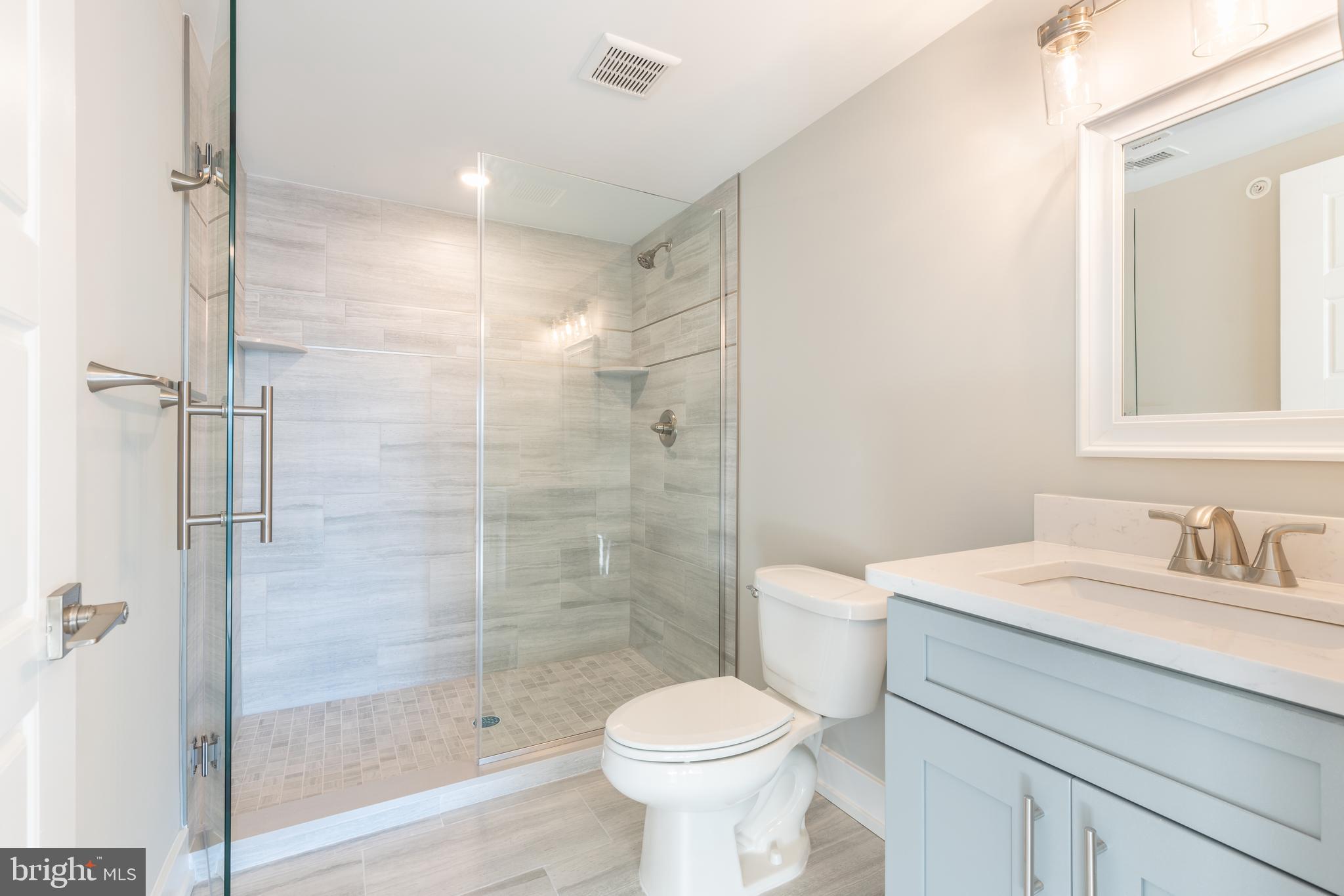 2517 Hope Street, Unit 5 Philadelphia, PA 19133 - Photo 13 of 35 a bathroom with a sink toilet and shower