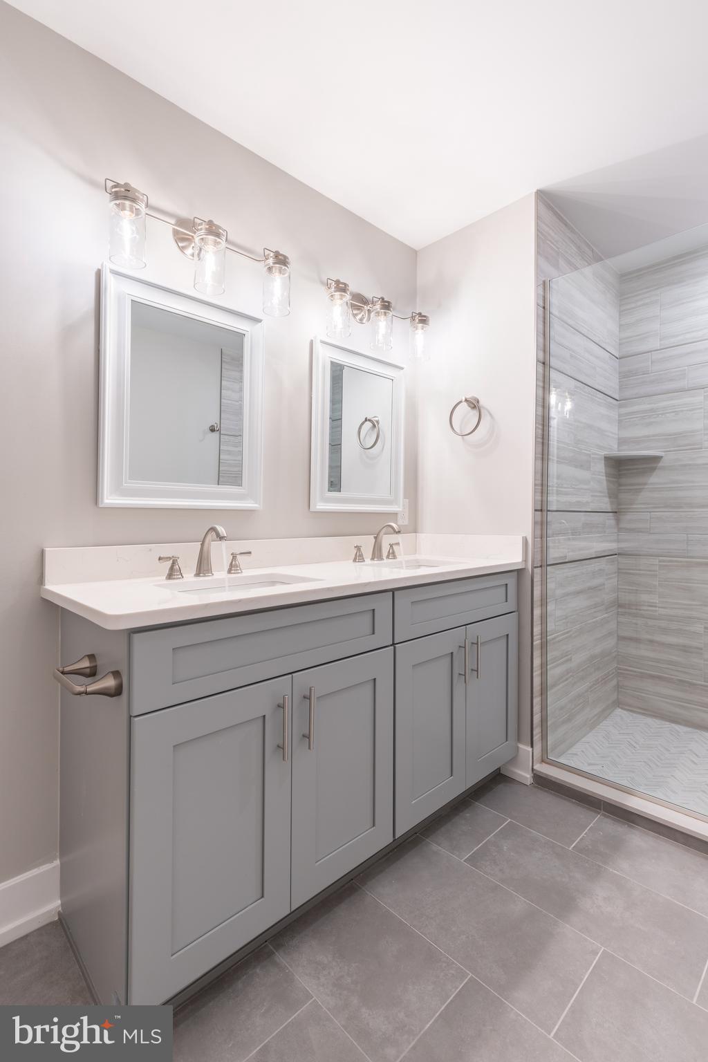 2517 Hope Street, Unit 5 Philadelphia, PA 19133 - Photo 22 of 35 a spacious bathroom with a double vanity sink mirror and double