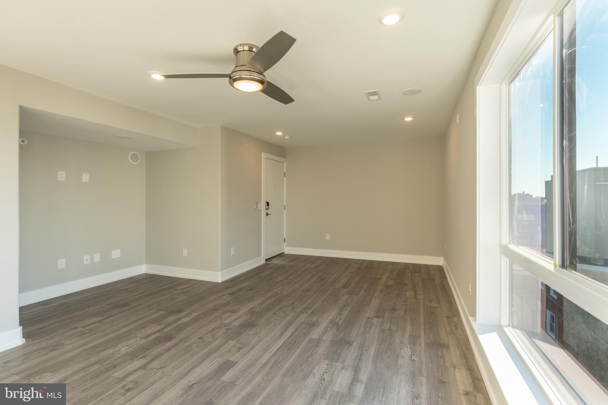2517 Hope Street, Unit 5 Philadelphia, PA 19133 - Photo 10 of 35 wooden floor in an empty room with a window