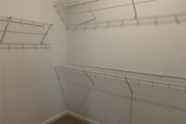 a white toilet and tub sitting next to a bathroom sink