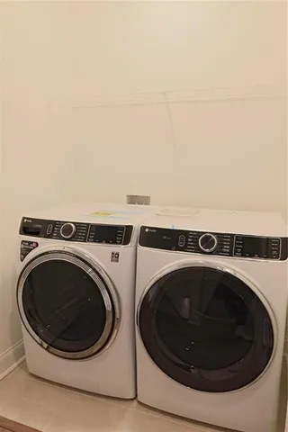 a bathroom with double vanity sink and a mirror