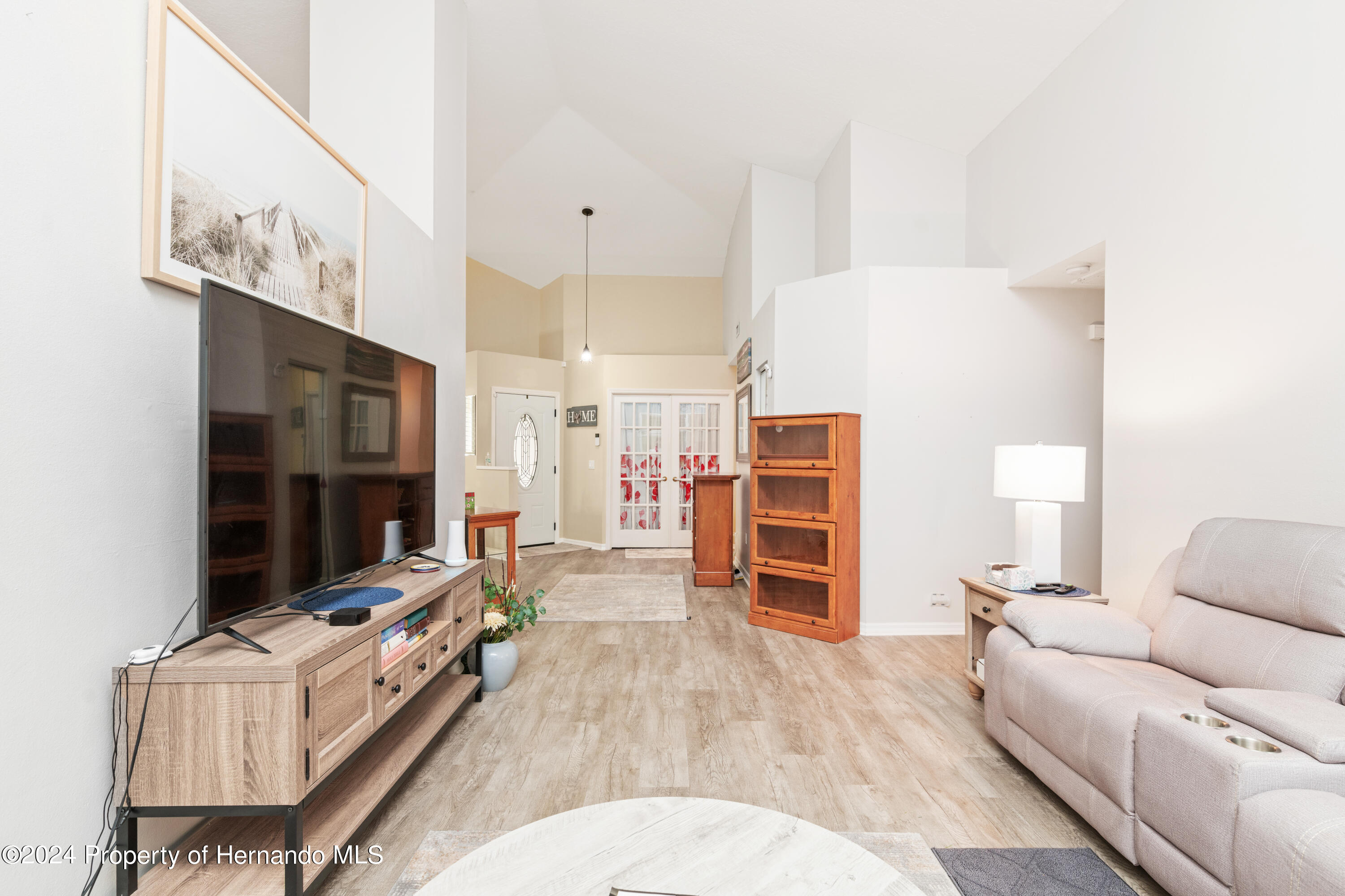 1 Byrsonima Loop Homosassa, FL 34446 - Photo 11 of 41 a living room with furniture and a flat screen tv