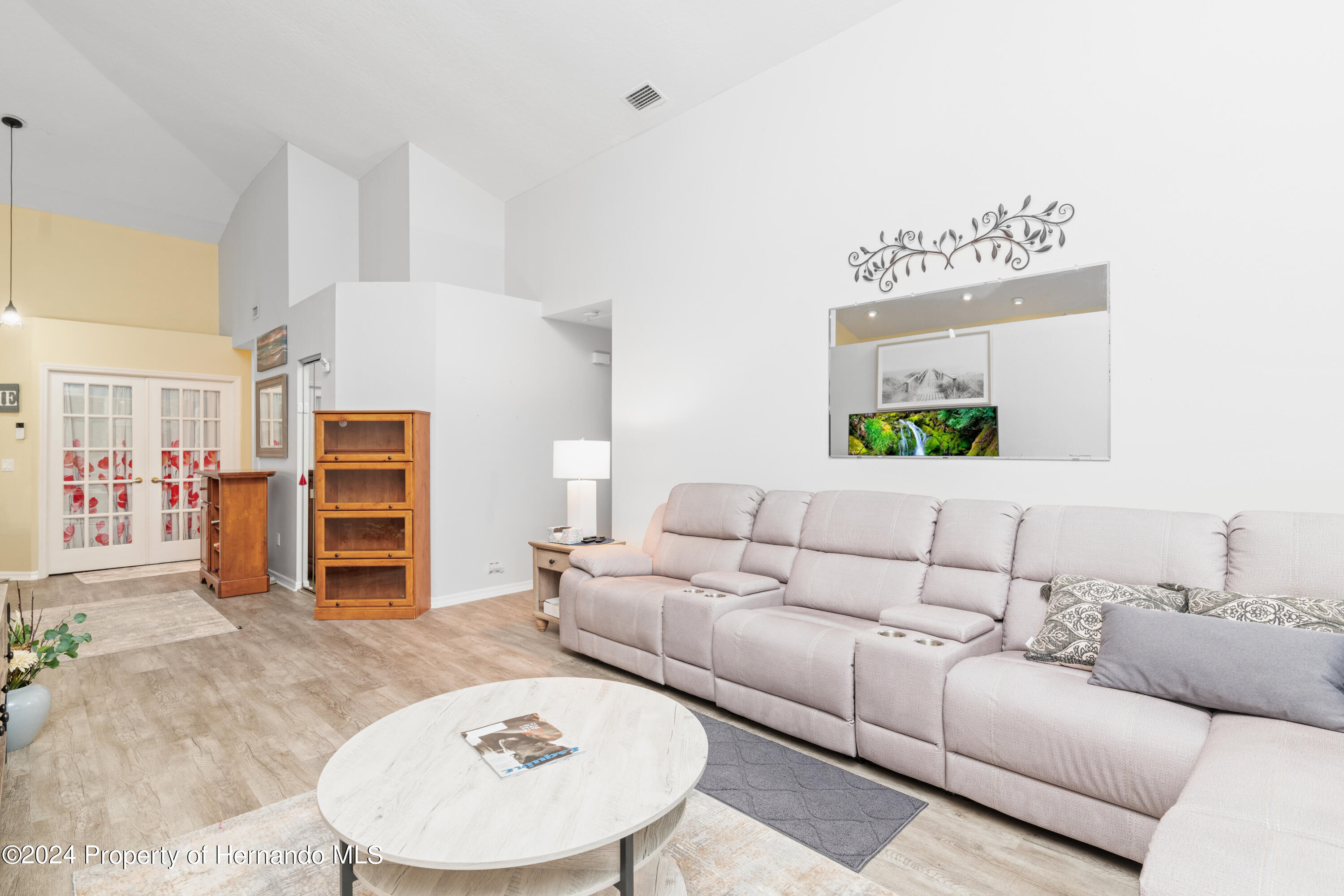 1 Byrsonima Loop Homosassa, FL 34446 - Photo 12 of 41 a living room with furniture and a flat screen tv