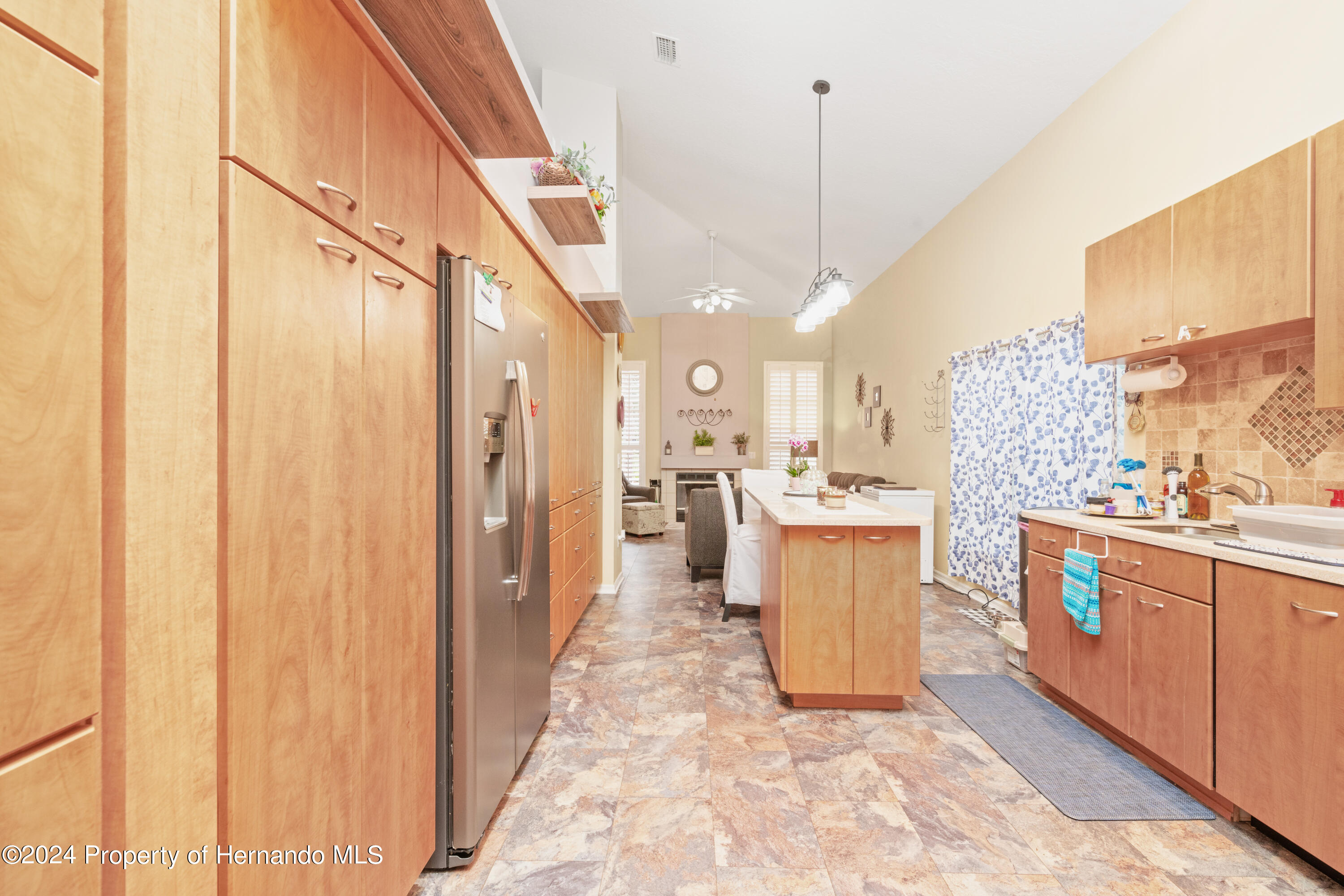 1 Byrsonima Loop Homosassa, FL 34446 - Photo 17 of 41 a large kitchen with a large window cabinets and stainless steel appliances