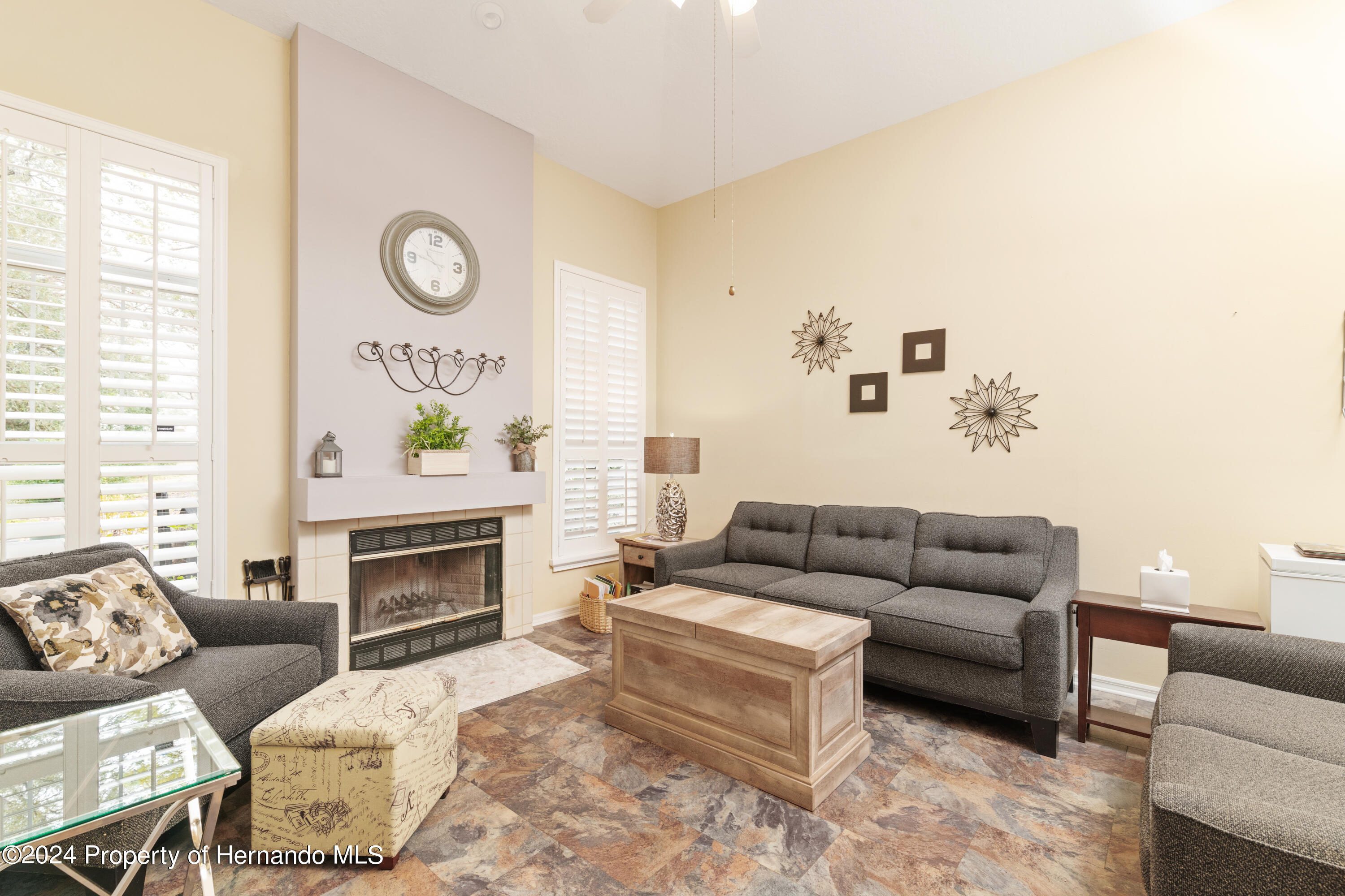 1 Byrsonima Loop Homosassa, FL 34446 - Photo 20 of 41 a living room with furniture and a fireplace