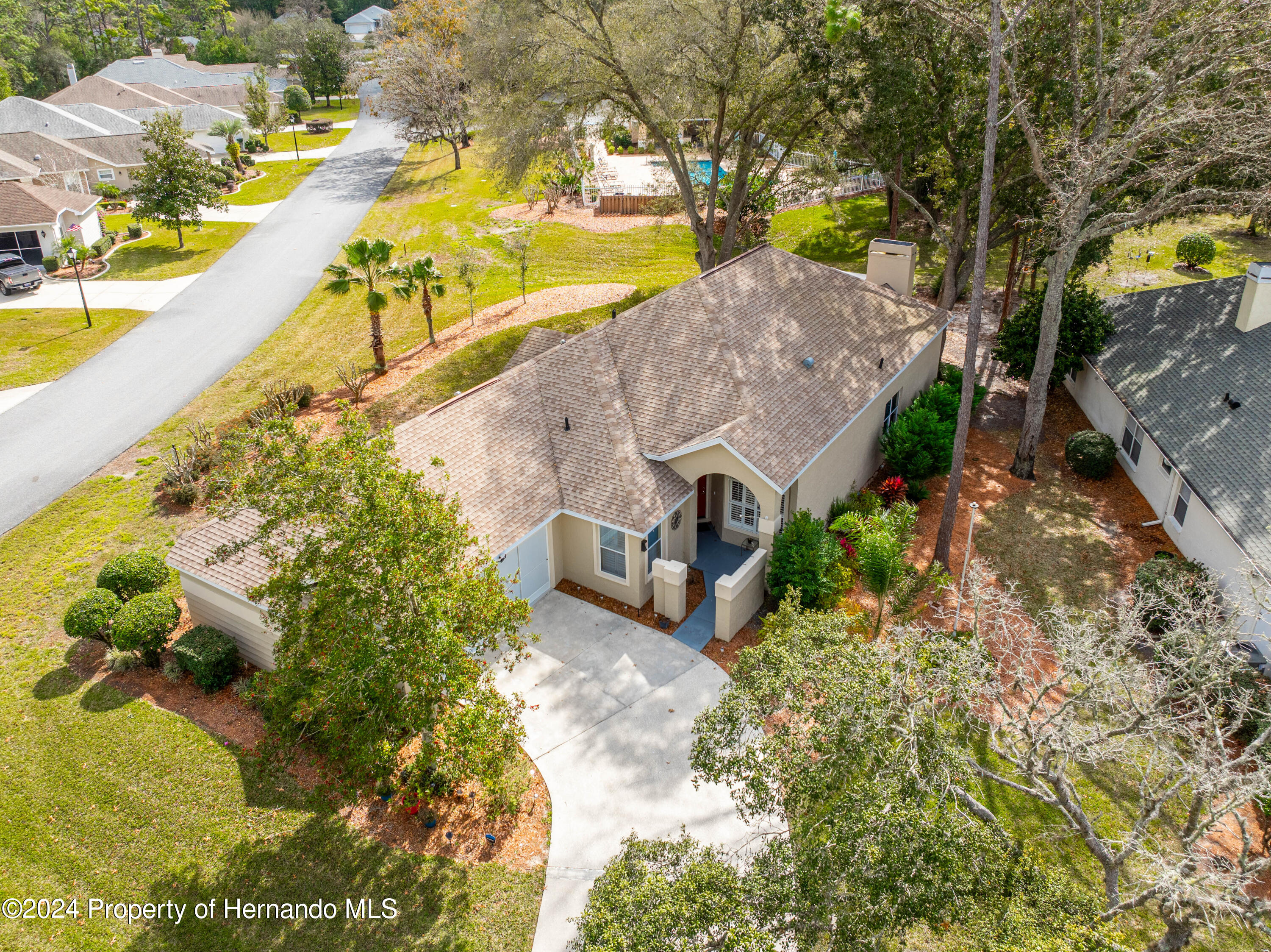 1 Byrsonima Loop Homosassa, FL 34446 - Photo 21 of 41 a view of a swimming pool with an outdoor space and seating area