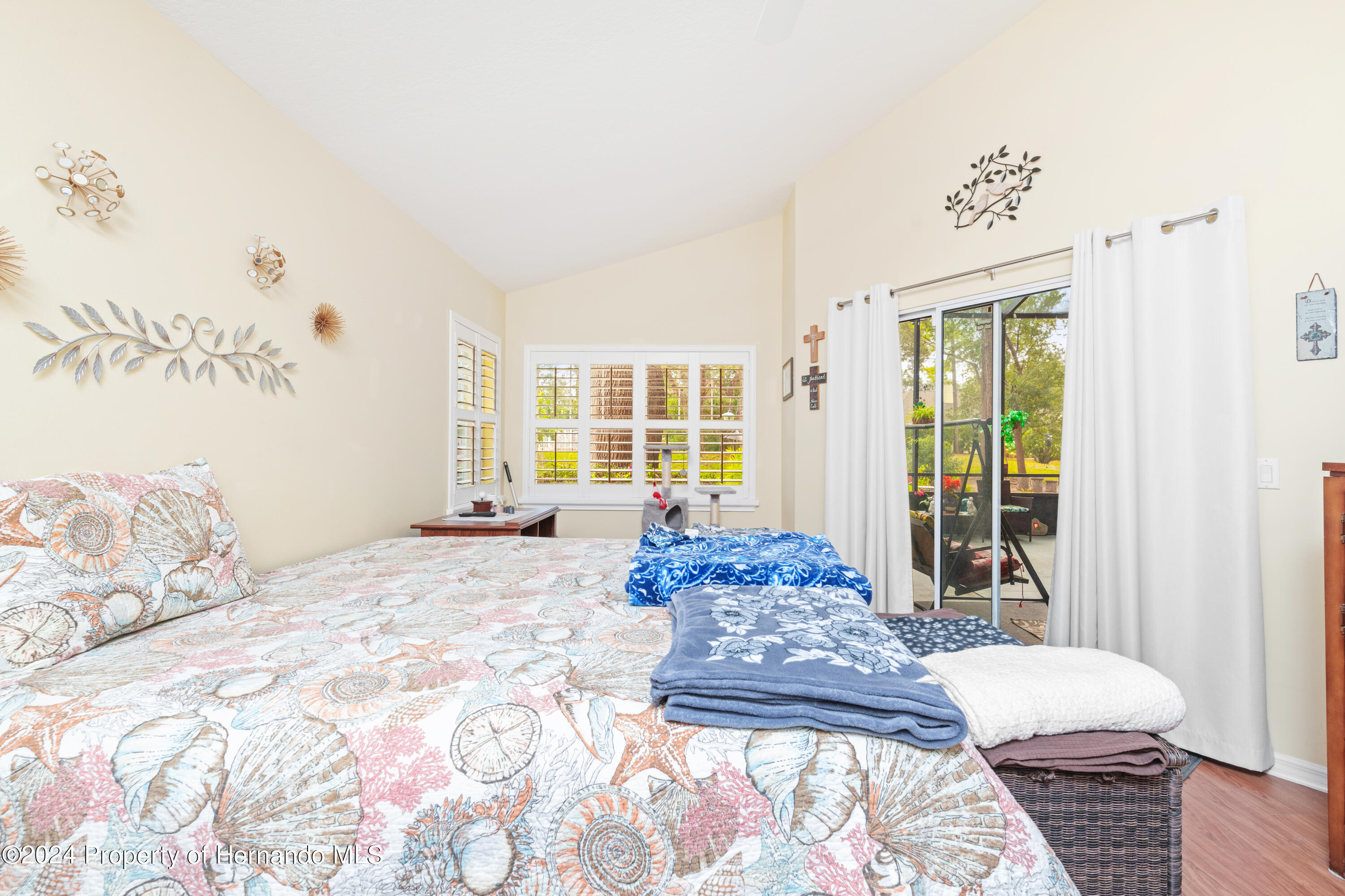 1 Byrsonima Loop Homosassa, FL 34446 - Photo 28 of 41 a spacious bedroom with a bed and a window