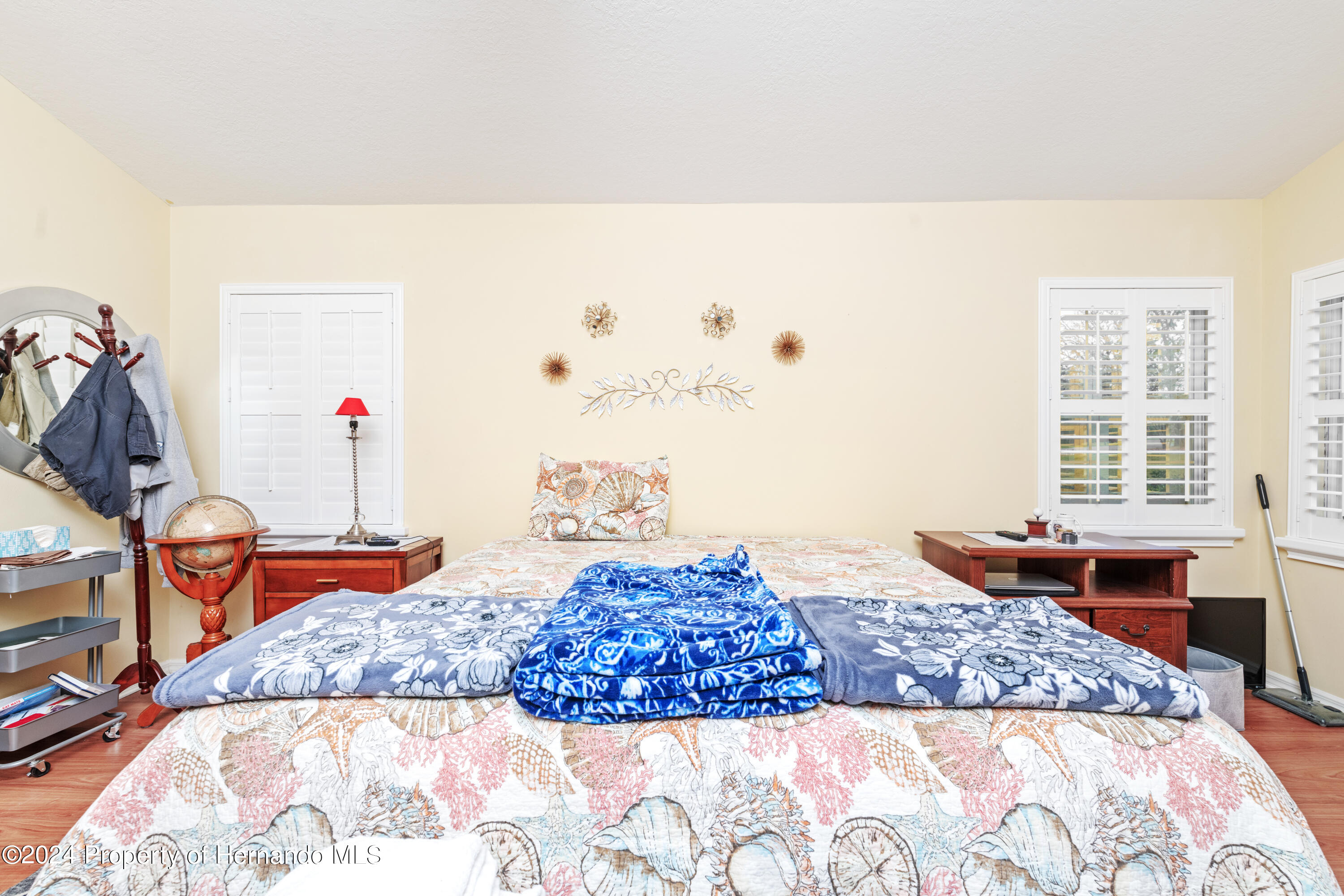 1 Byrsonima Loop Homosassa, FL 34446 - Photo 29 of 41 a bedroom with a bed and a couch