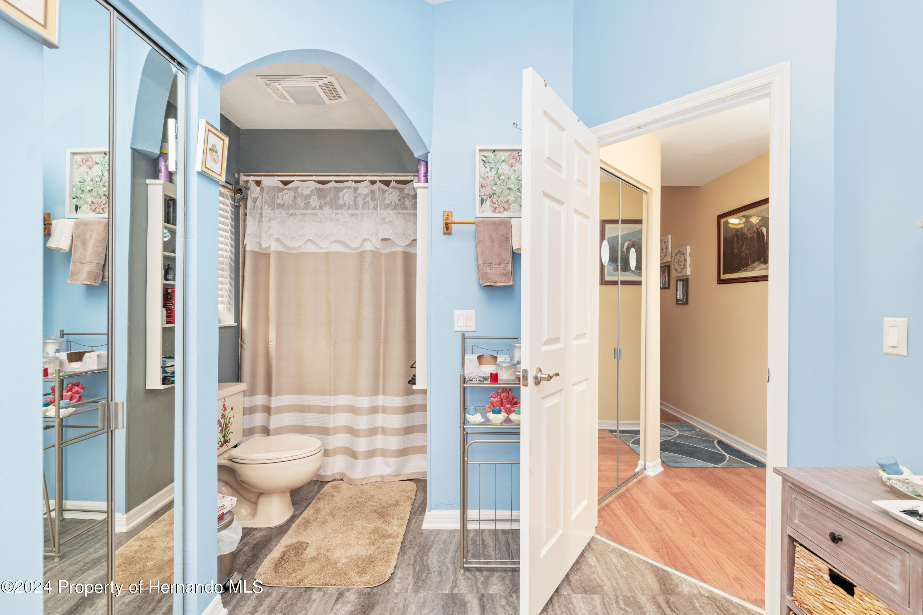 1 Byrsonima Loop Homosassa, FL 34446 - Photo 31 of 41 a bathroom with a granite countertop sink a toilet and shower