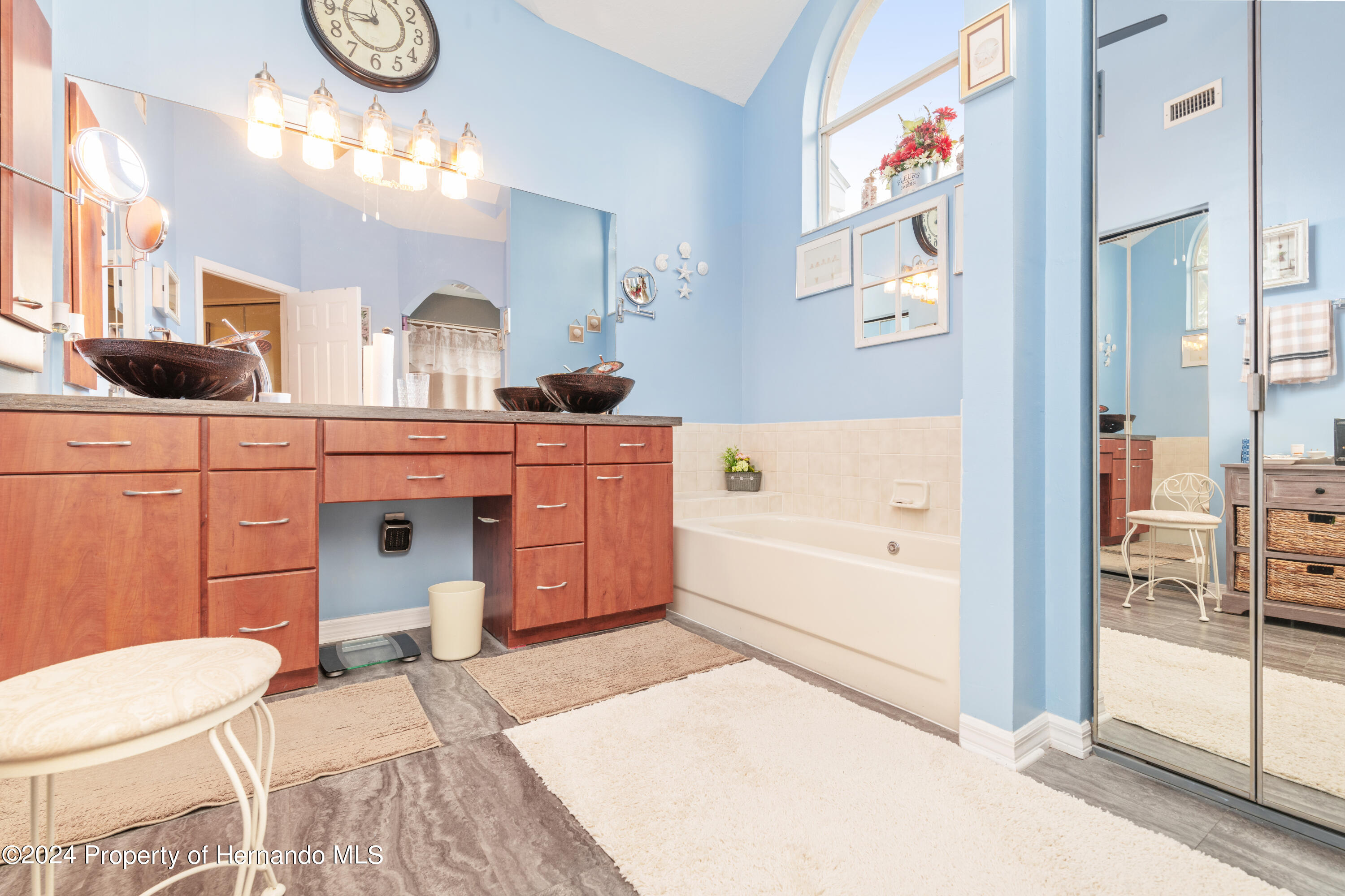 1 Byrsonima Loop Homosassa, FL 34446 - Photo 33 of 41 a spacious bathroom with a tub sink and mirror