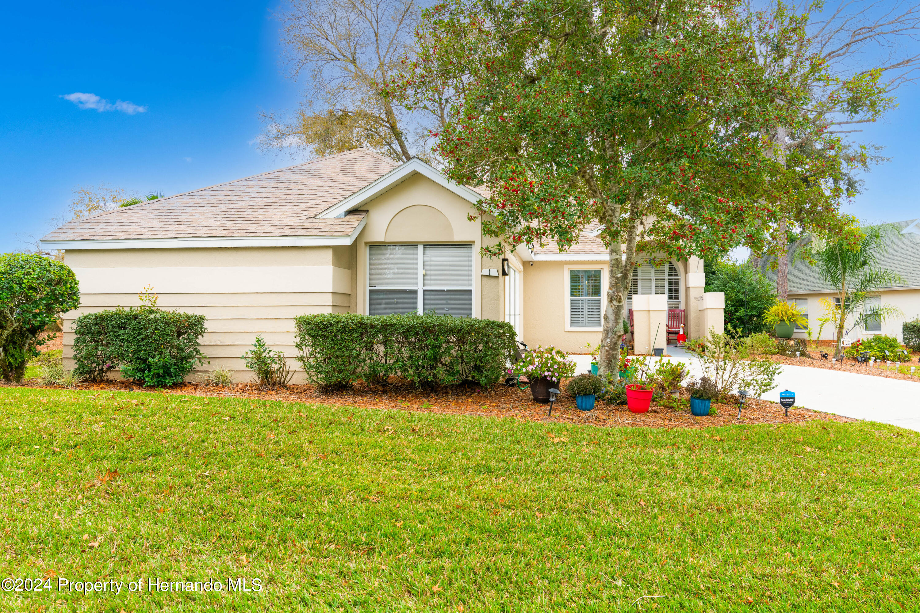 1 Byrsonima Loop Homosassa, FL 34446 - Photo 34 of 41 a front view of house with yard and green space