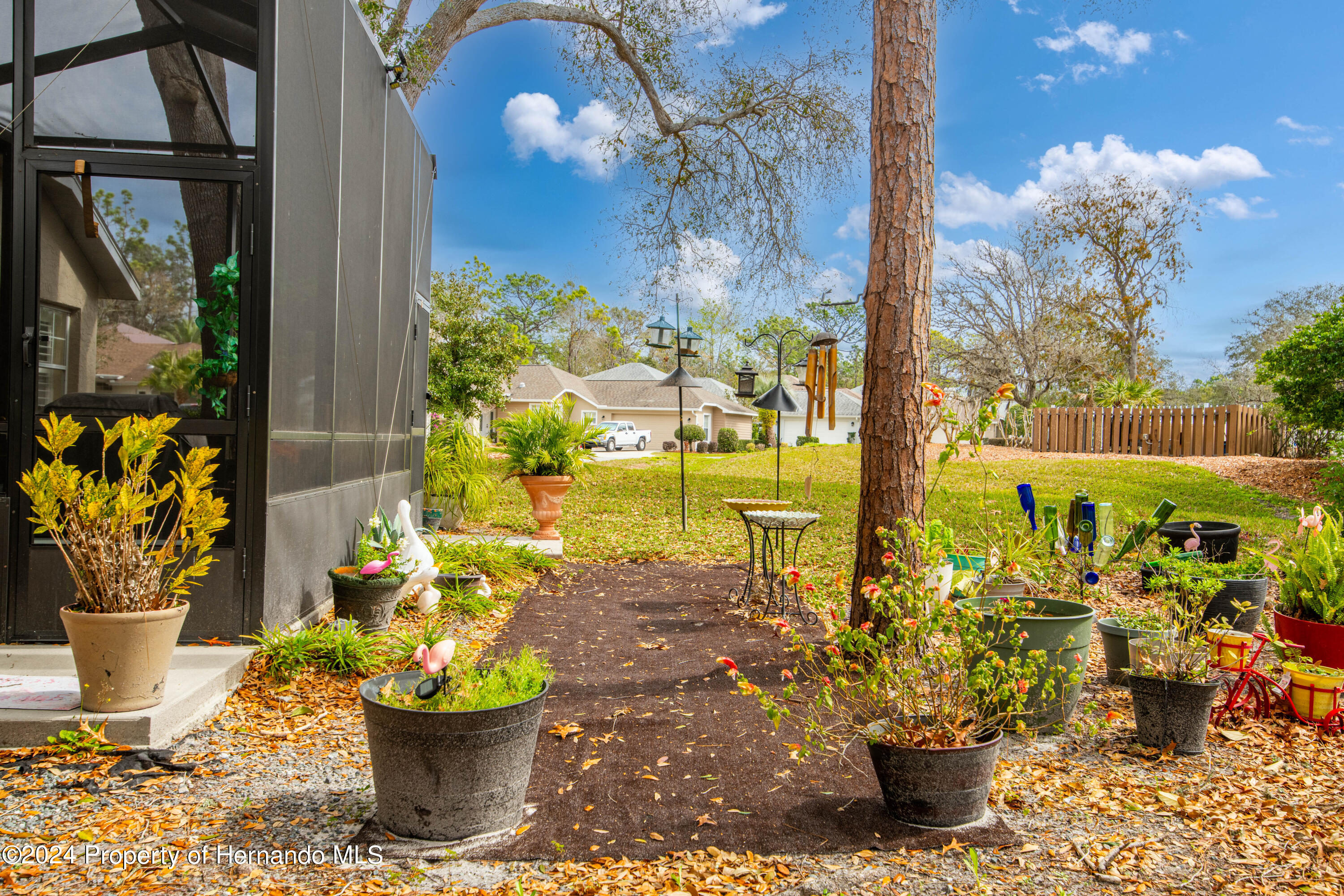 1 Byrsonima Loop Homosassa, FL 34446 - Photo 38 of 41 a view of a potted flower in a yard