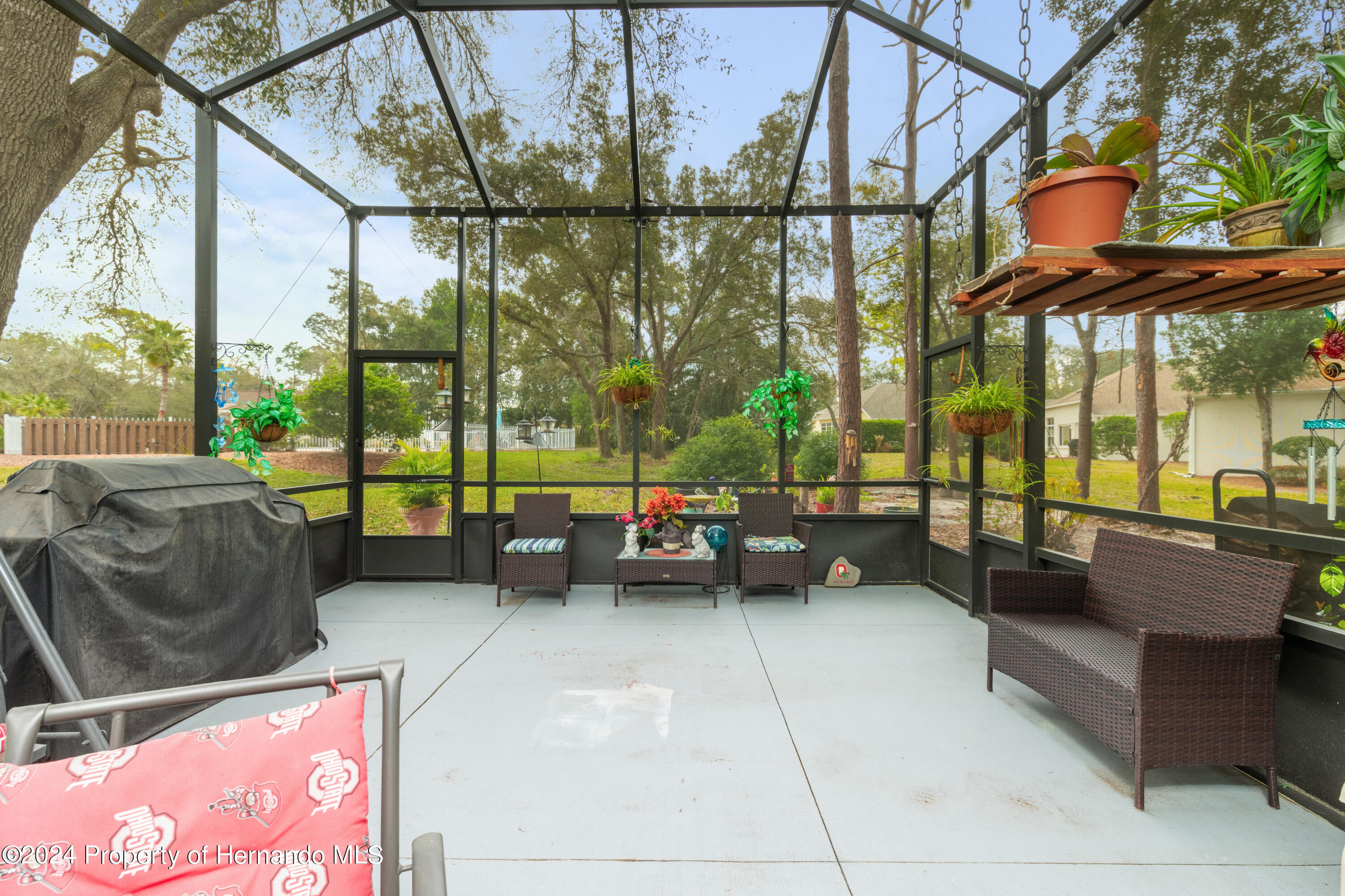 1 Byrsonima Loop Homosassa, FL 34446 - Photo 40 of 41 a view of living room with patio furniture and a floor to ceiling window