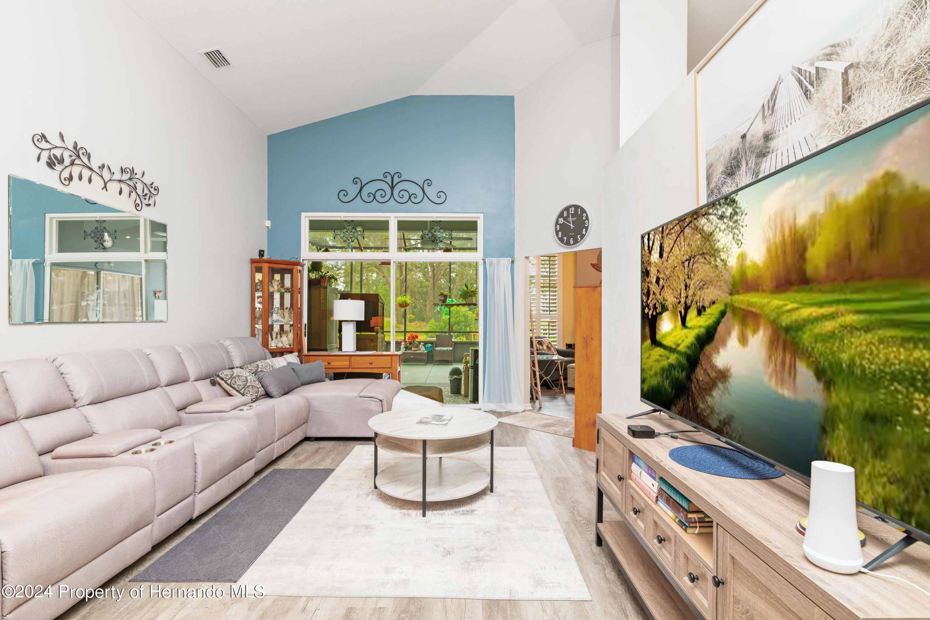1 Byrsonima Loop Homosassa, FL 34446 - Photo 9 of 41 a living room with furniture and a flat screen tv