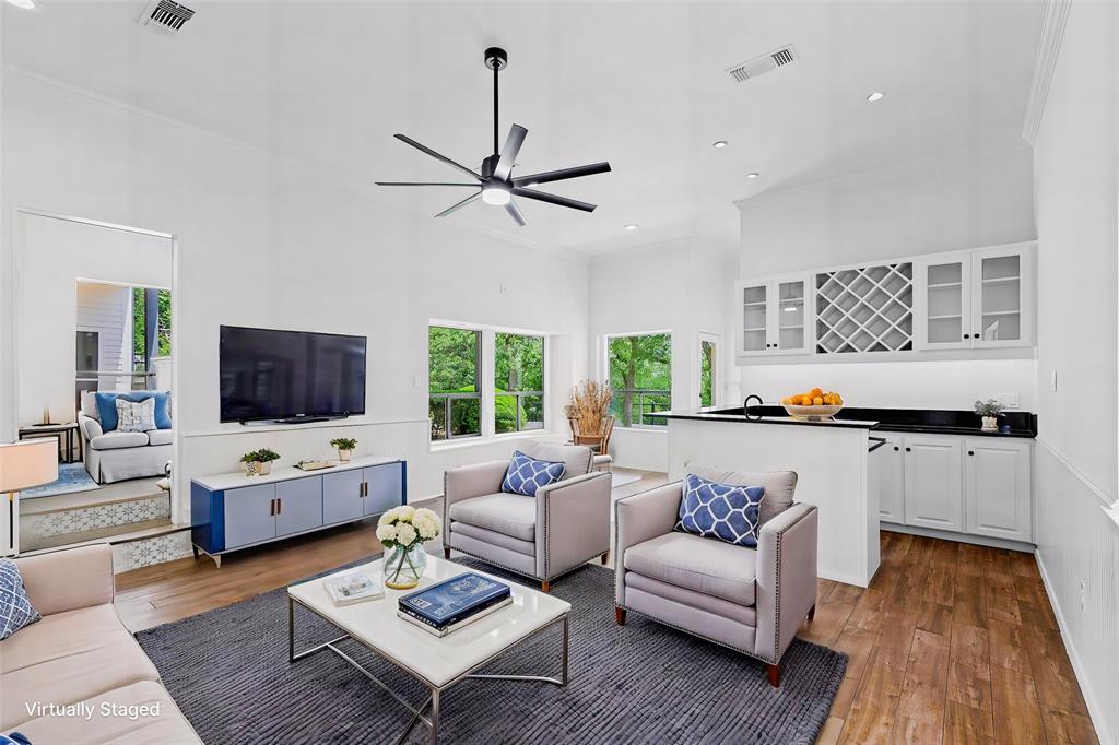 2109 Greta Lane Fort Worth, TX 76120 - Photo 17 of 40 a living room with furniture and a flat screen tv