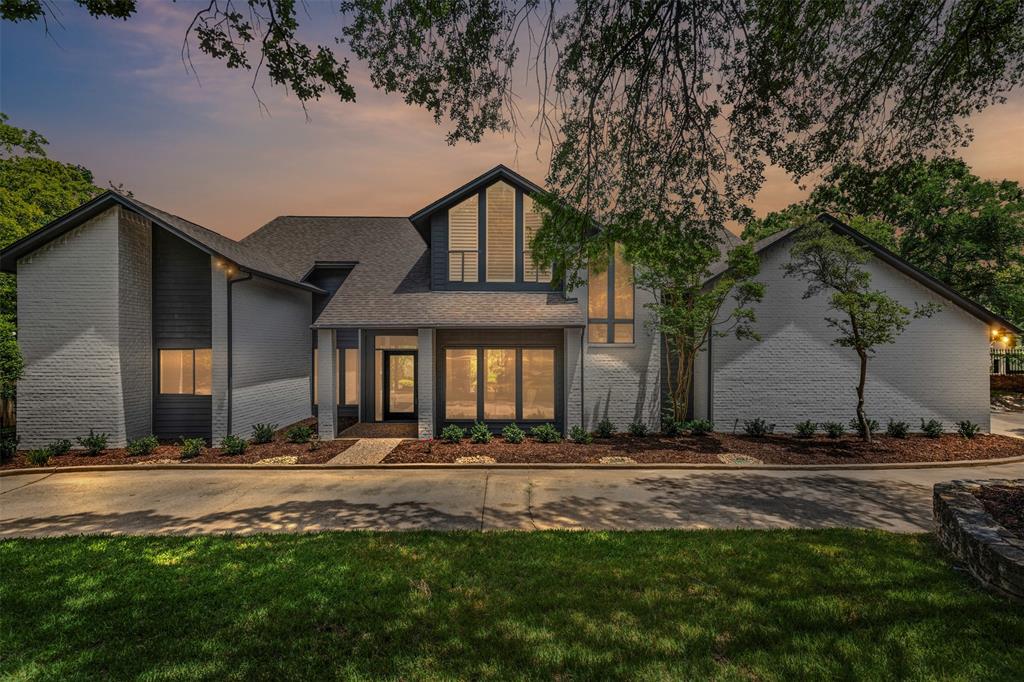 2109 Greta Lane Fort Worth, TX 76120 - Photo 2 of 40 a front view of a house with a yard