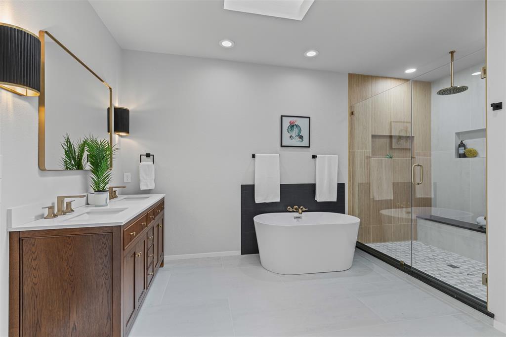 2109 Greta Lane Fort Worth, TX 76120 - Photo 23 of 40 a en suite bathroom with a double vanity sink a mirror and a shower