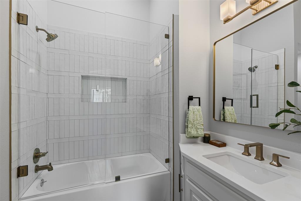 2109 Greta Lane Fort Worth, TX 76120 - Photo 30 of 40 a bathroom with a bathtub and a sink