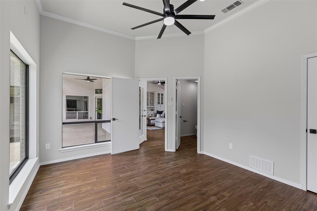 2109 Greta Lane Fort Worth, TX 76120 - Photo 31 of 40 a view of empty room with wooden floor and window