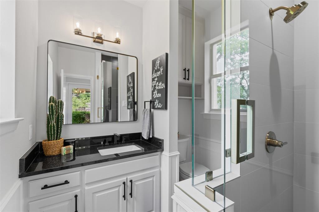 2109 Greta Lane Fort Worth, TX 76120 - Photo 32 of 40 a bathroom with a double vanity sink and mirror