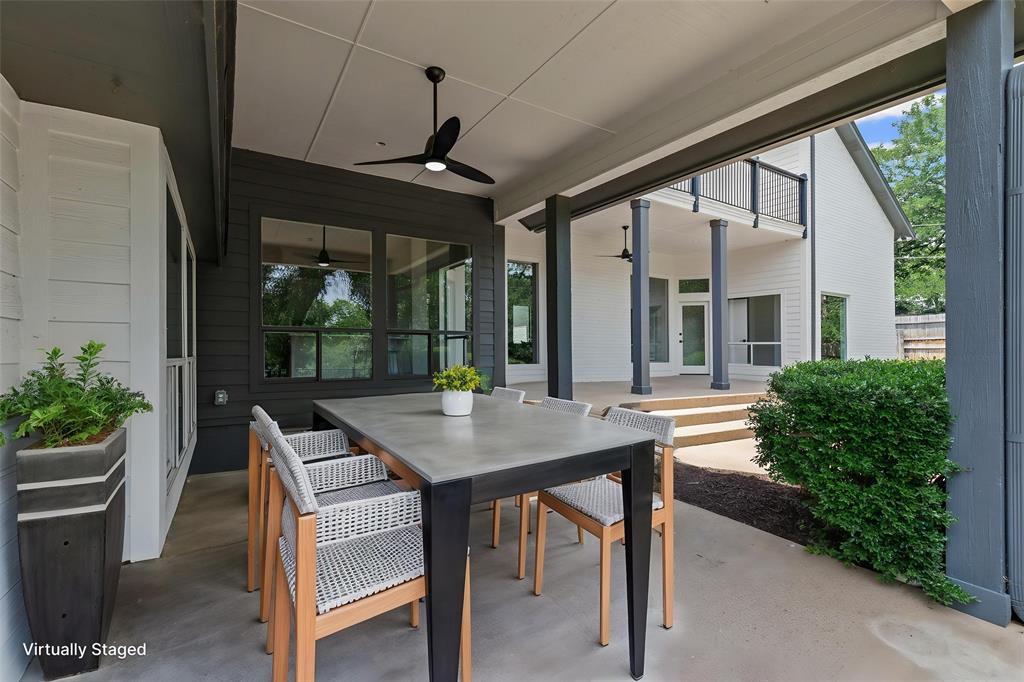 2109 Greta Lane Fort Worth, TX 76120 - Photo 33 of 40 a view of a patio with a table chairs and a potted plant