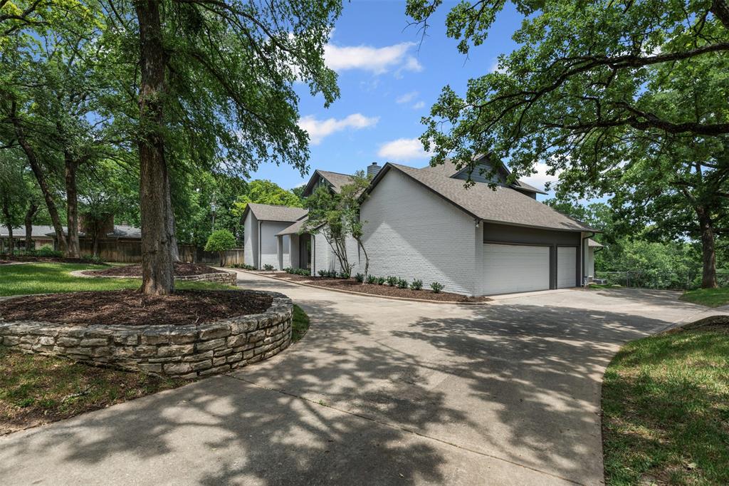 2109 Greta Lane Fort Worth, TX 76120 - Photo 4 of 40 a view of a house with a yard