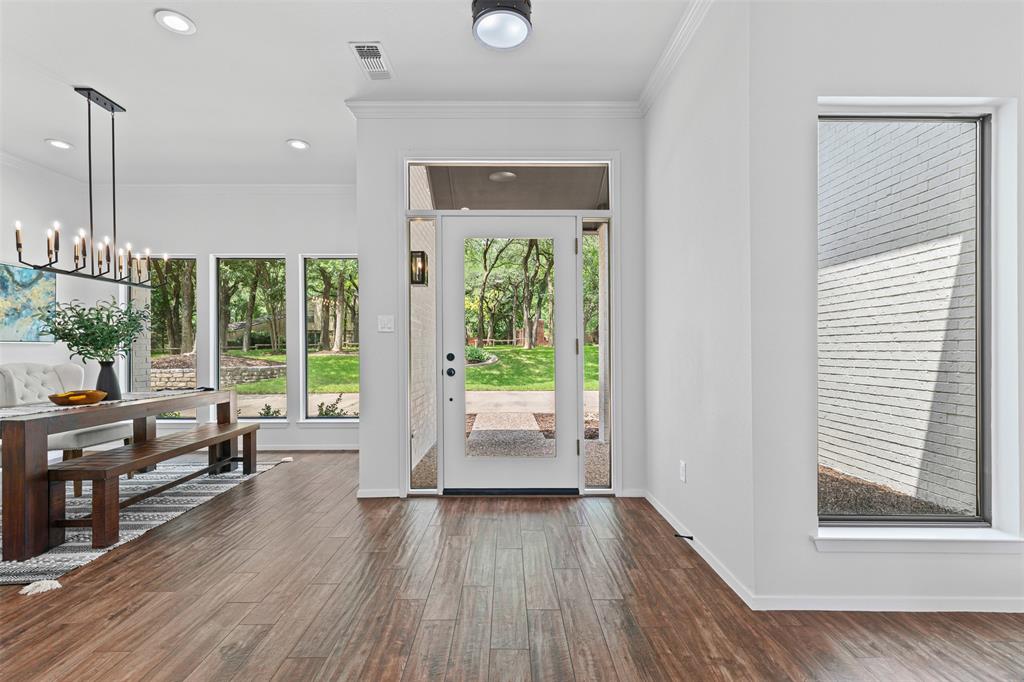 2109 Greta Lane Fort Worth, TX 76120 - Photo 9 of 40 wooden floor in an empty room with a window