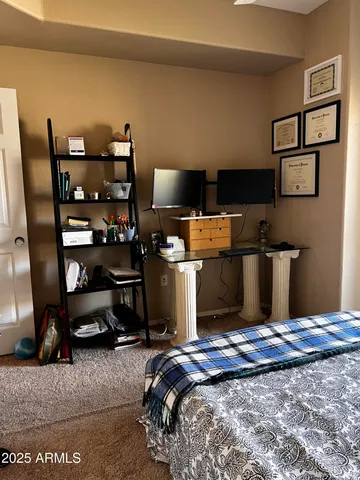 a bedroom with a bed and furniture