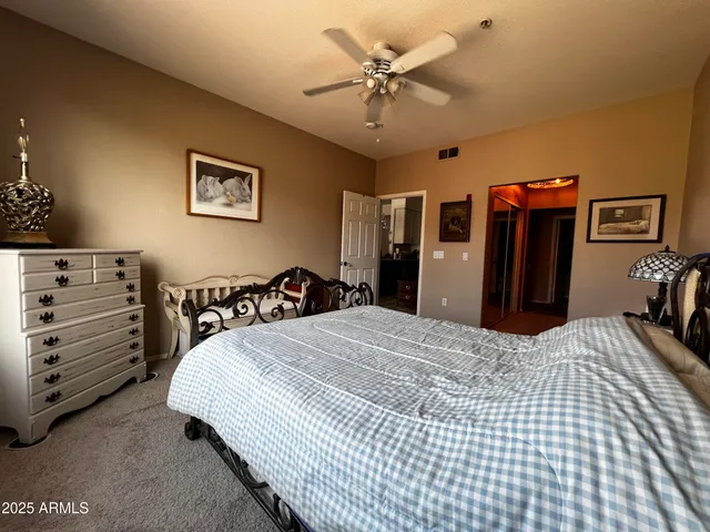 a bedroom with a bed and a dresser