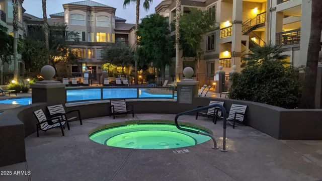 a swimming pool with outdoor seating and yard
