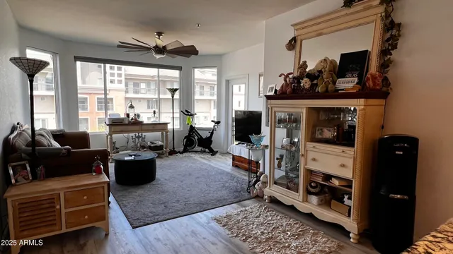 a living room with furniture and wooden floor