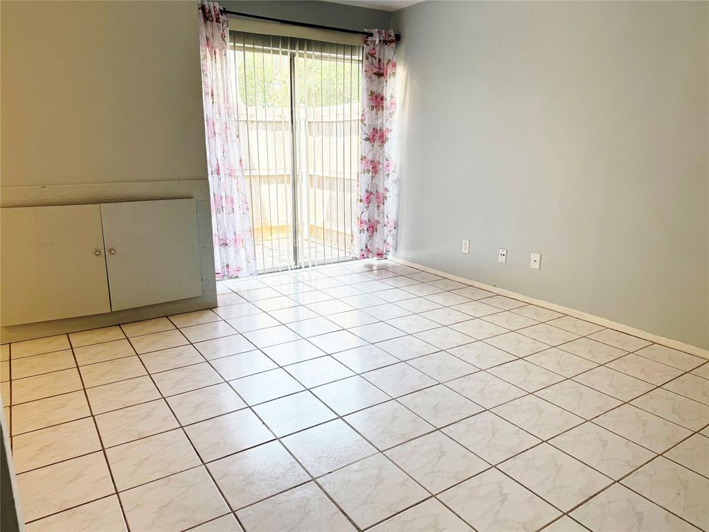 11311 Audelia Road, Unit 161 Dallas, TX 75243 - Photo 3 of 15 Empty room featuring light tile patterned flooring