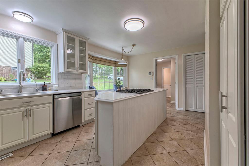 3222 Ridgeway Road Greensburg, PA 15601 - Photo 22 of 46 a large white kitchen with a sink and dishwasher a open kitchen view