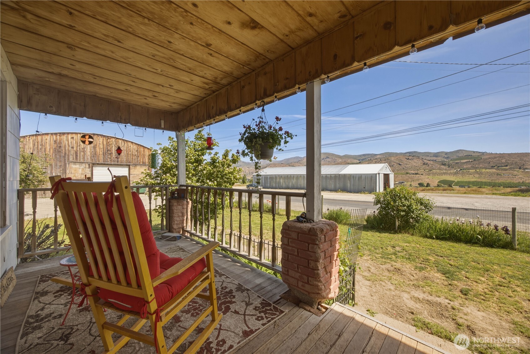 1281 Totem Pole Road Manson, WA 98831 - Photo 2 of 39 a roof deck with wooden floor and outdoor space