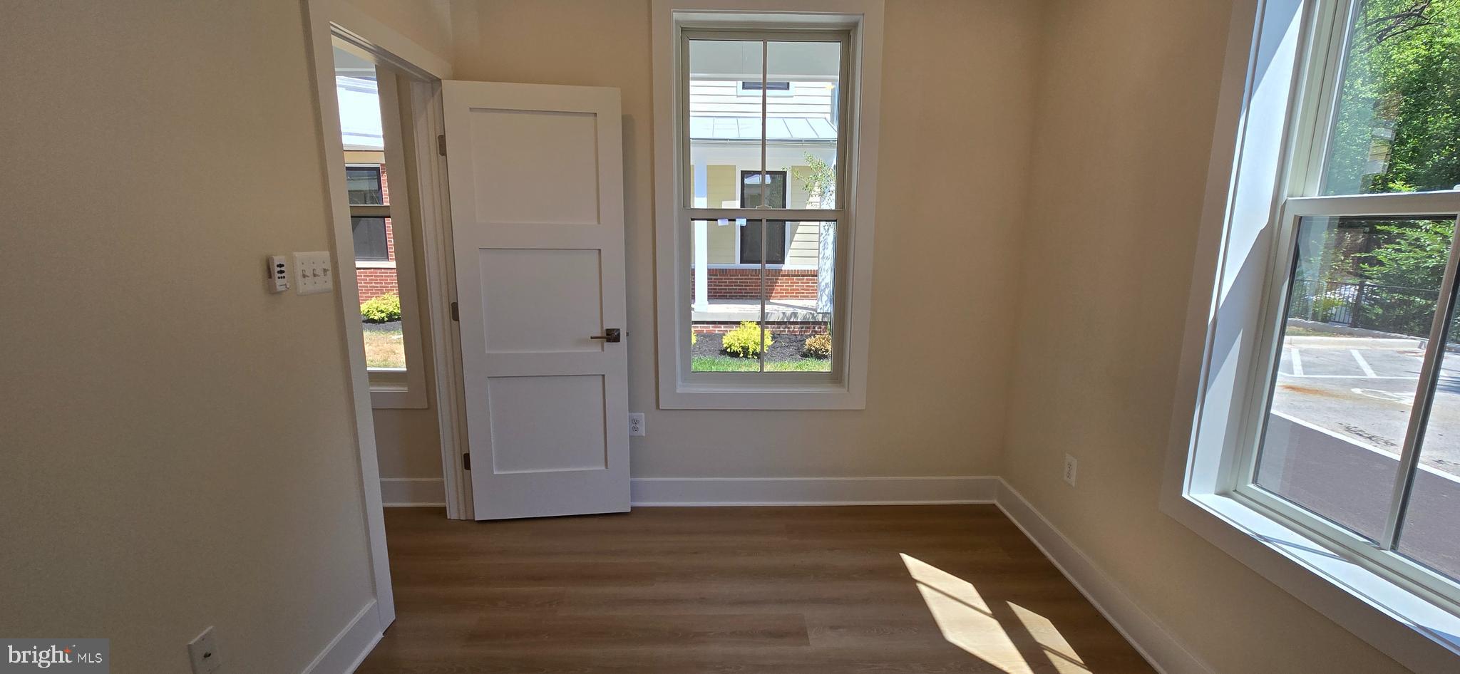412 Chapel Alley, Unit 1 Frederick, MD 21701 - Photo 7 of 41 a view of an entryway with wooden floor and windows