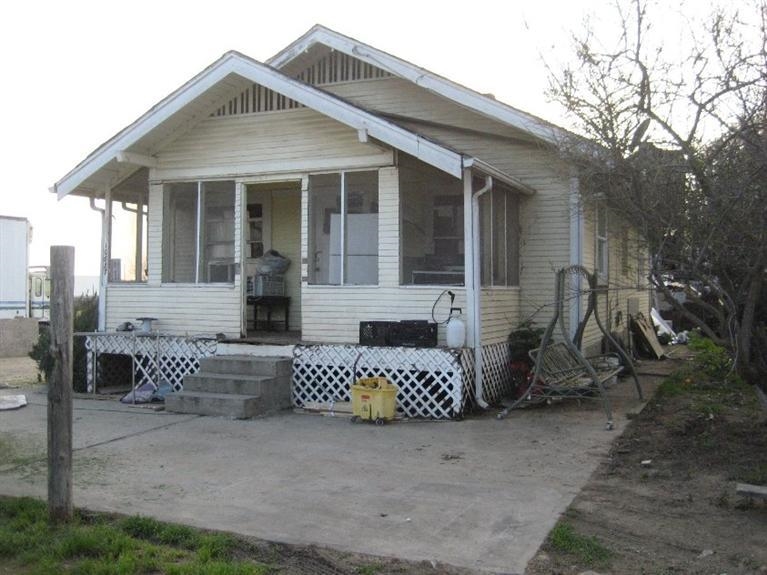10887 South Reed Avenue Reedley, CA 93654 - Photo 1 of 1 a front view of a house with patio