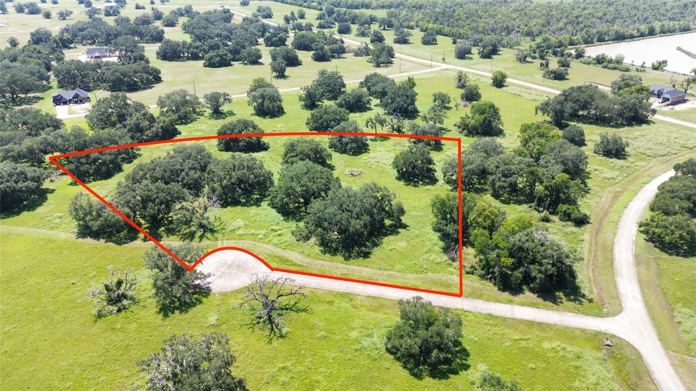 0 Old Henry Court Angleton, TX 77515 - Photo 3 of 10 an aerial view of a house with a yard and lake view