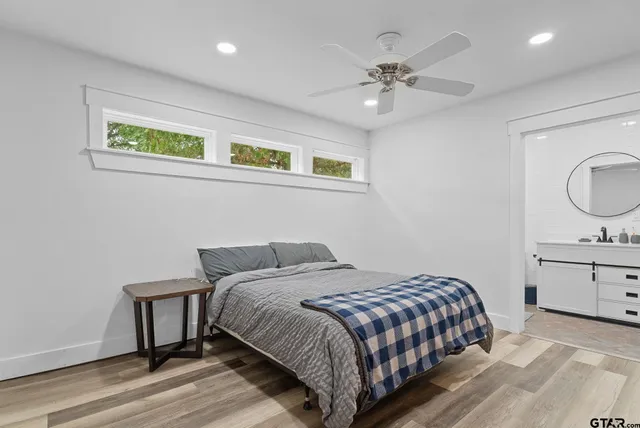 a bedroom with a bed and a dresser